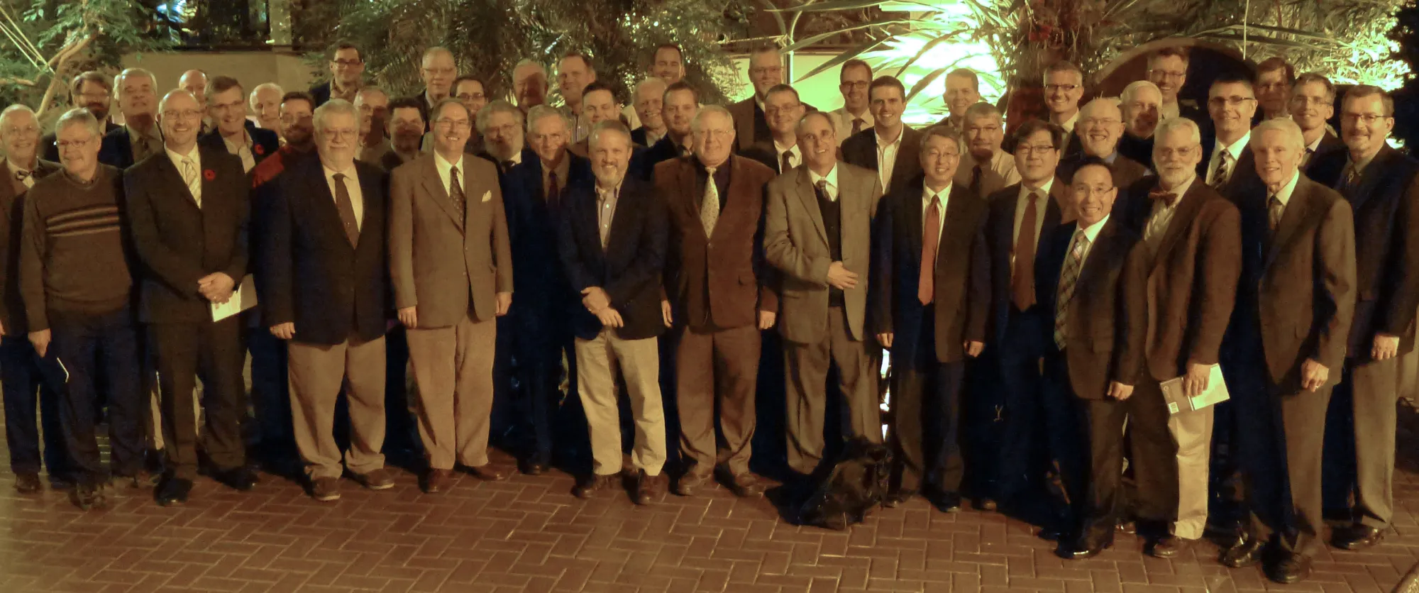 Delegates and observers at the 41st NAPARC annual meeting, gathered on a brick patio at the Québec Inn in Québec City