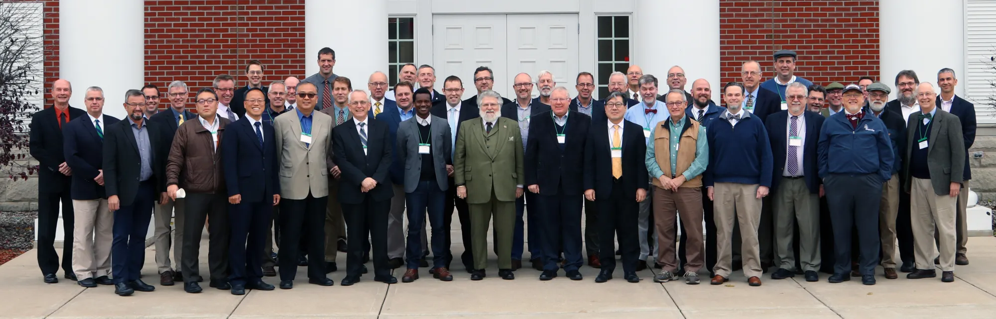 Delegates and observers at the 43rd NAPARC annual meeting, standing outside Puritan Reformed Theological Seminary in Grand Rapids, Michigan