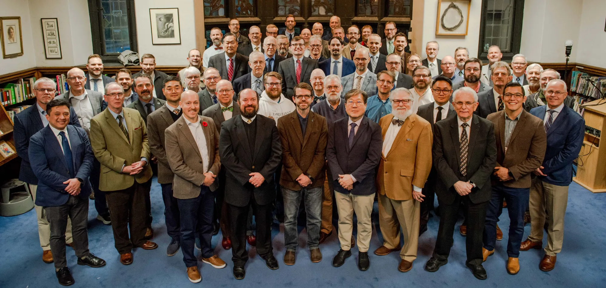 Delegates and observers at the 50th NAPARC annual meeting, gathered in a library in Beaver Falls, Pennsylvania